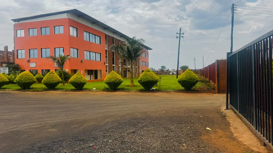 The view from the Elite High School gate across the courtyard to the classroom block