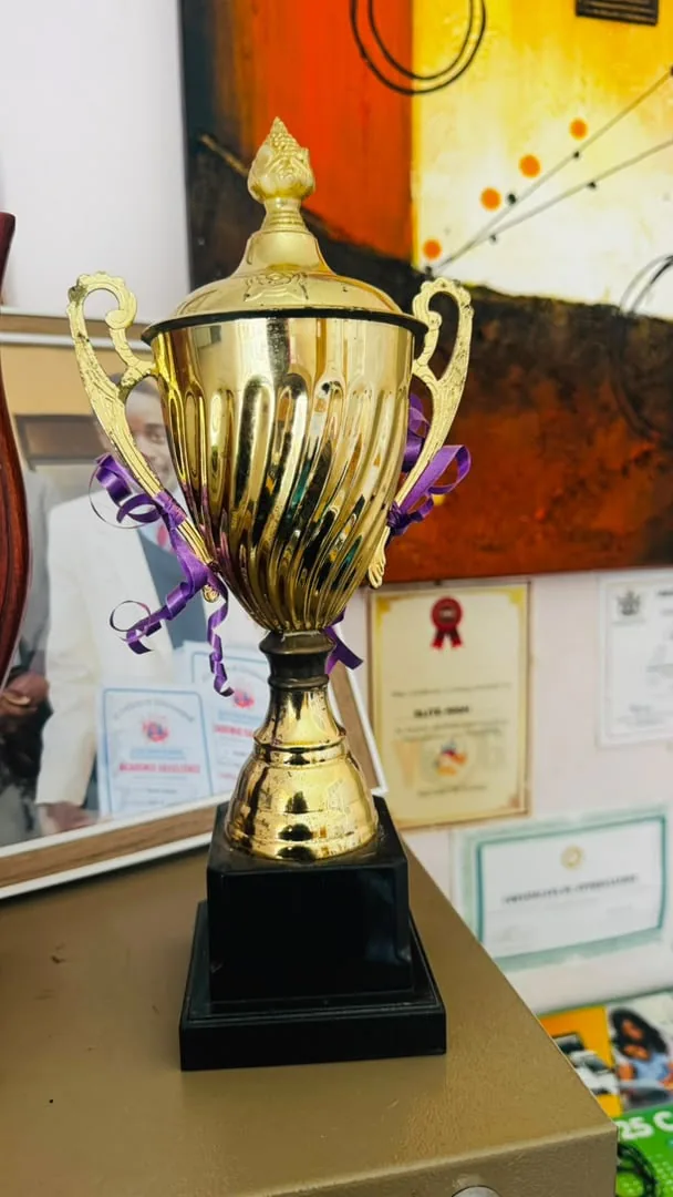 A gold trophy on display at Elite High School